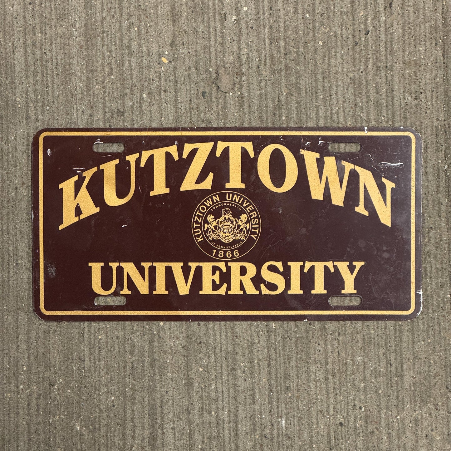 Photo of a 1970 Era Pennsylvania License Plate Booster License Plate Auto Tag Garage Decor Vintage Metal College Kutztown University with original patina
