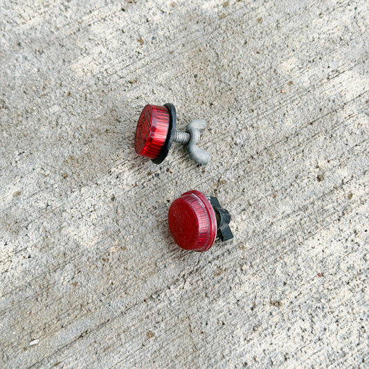 Photo of a 1970 Era Red Jewel License Plate Auto Tag Garage Decor Vintage Reflector Set Mismatched Round Bike Car Motorcycle with original patina