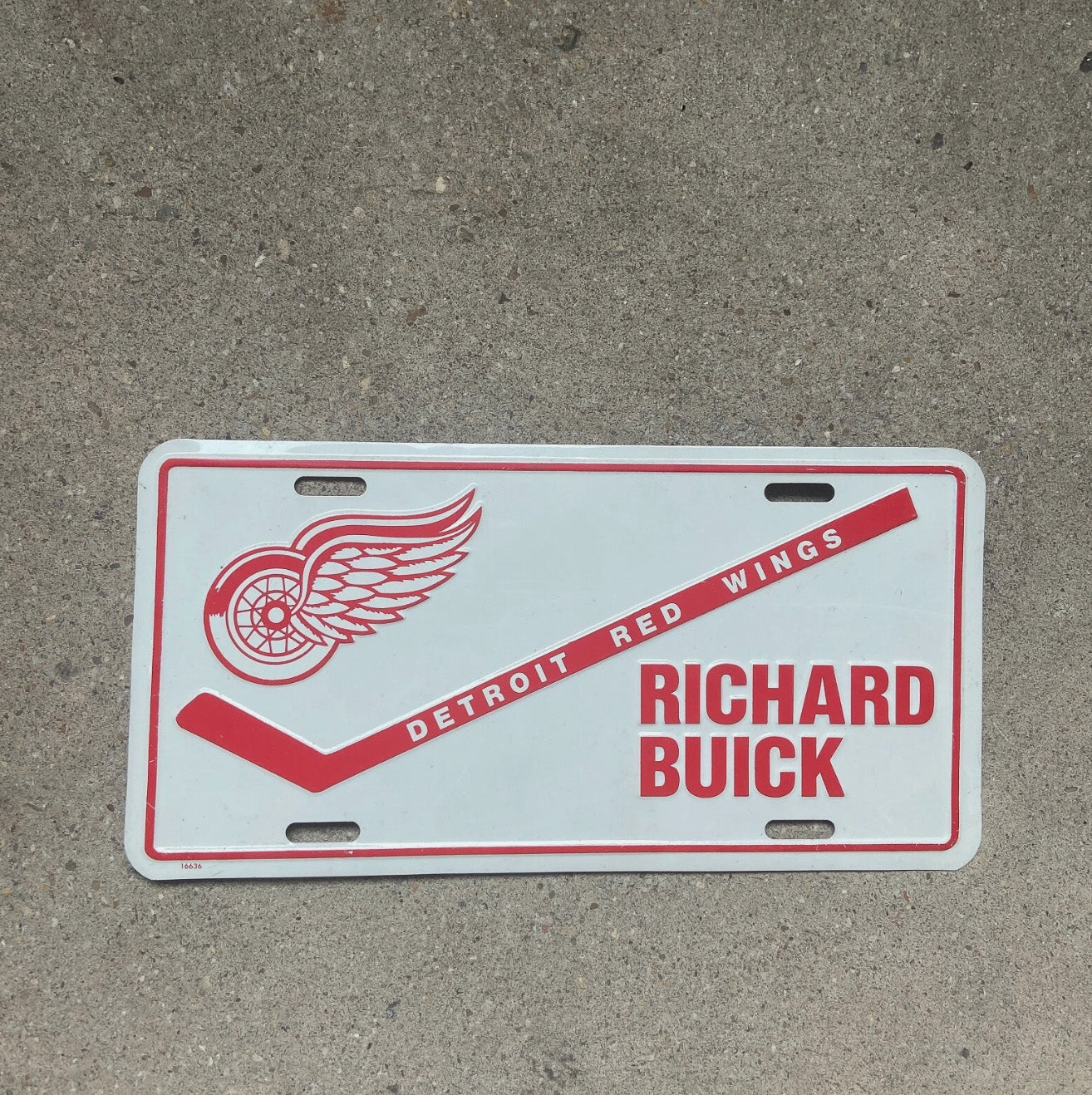 Photo of a 1970 Era Richard Buick Michigan Booster License Plate Auto Tag Garage Decor Vintage Detroit Red Wings NHL Hockey with original patina