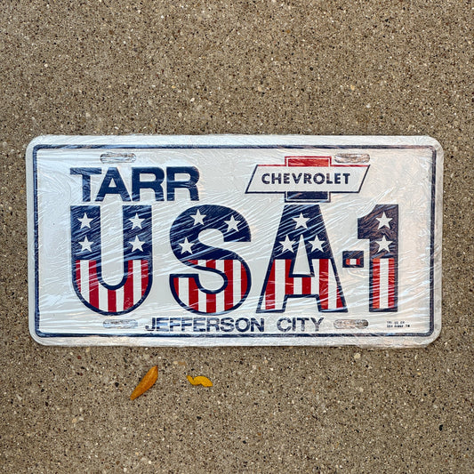 Photo of a 1970 Era Tennessee Booster License Plate Auto Tag Garage Decor Vintage Tarr Chevrolet Jeffreson City Metal USA 1 with original patina