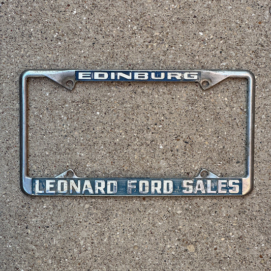 Photo of a 1970 Era Texas License Plate Frame Auto Tag Garage Decor Vintage Leonard Ford Sales Dealer Edinburg Leonard Ford Sales with original patina