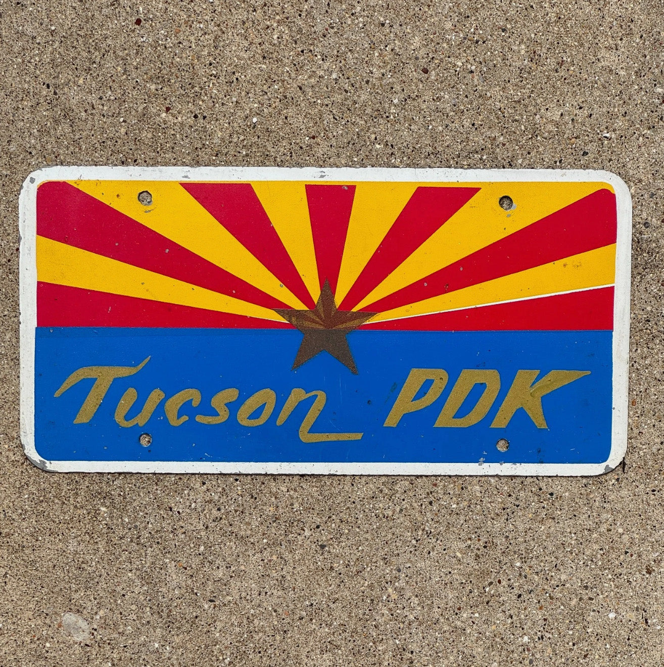 Photo of a 1970 Era Tucson Arizona Booster License Plate Auto Tag Garage Decor Vintage PDK Phi Delta Kappa ? Gold Star Tucson PDK with original patina