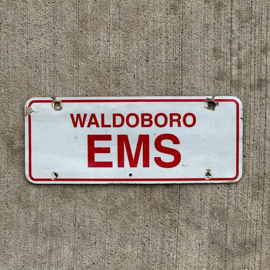 Photo of a 1970 Era Waldoboro Maine EMS License Plate Topper Auto Tag Garage Decor Vintage with original patina