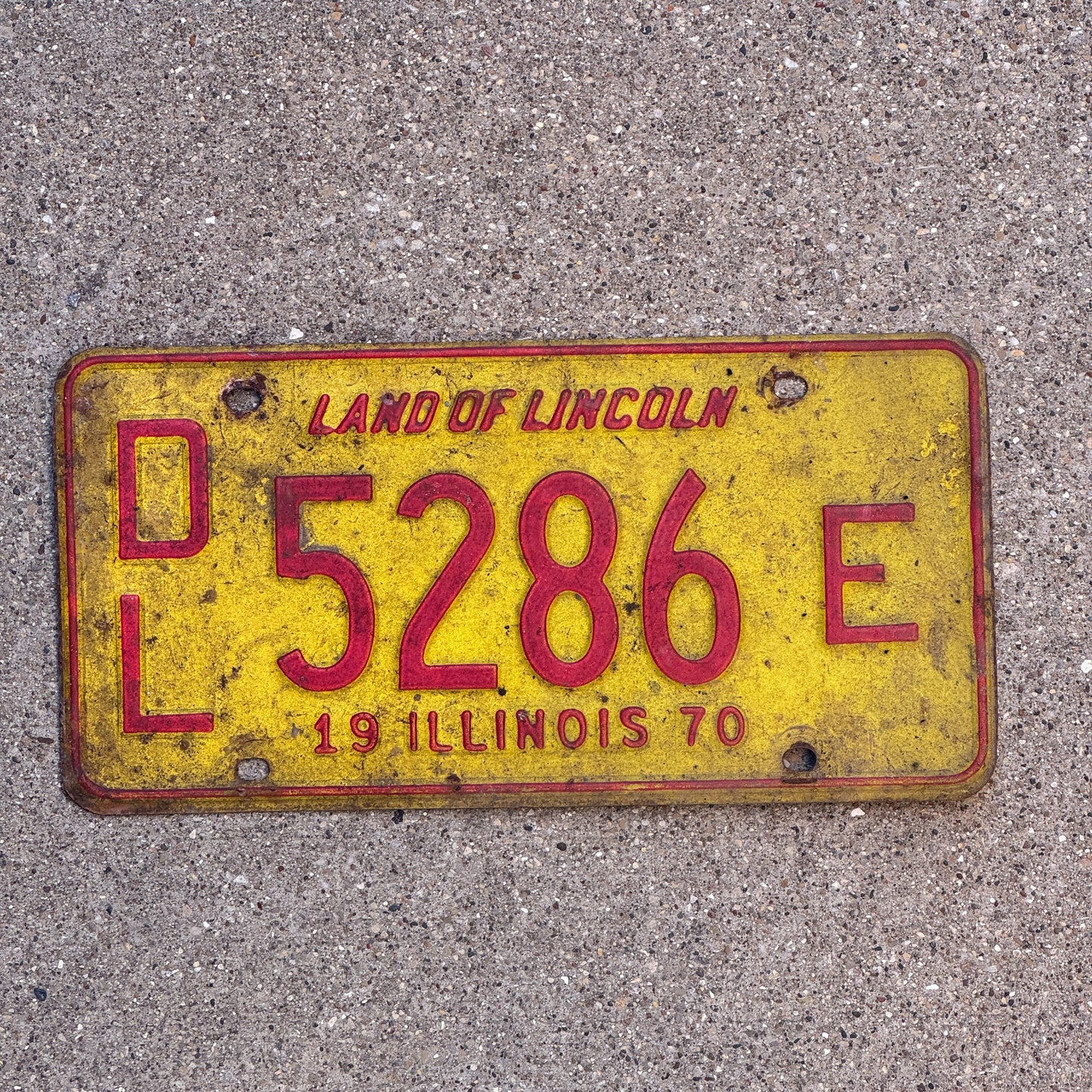 Photo of a 1970 Illinois Dealer License Plate Auto Tag 1 Vintage Garage 5286 E with original patina