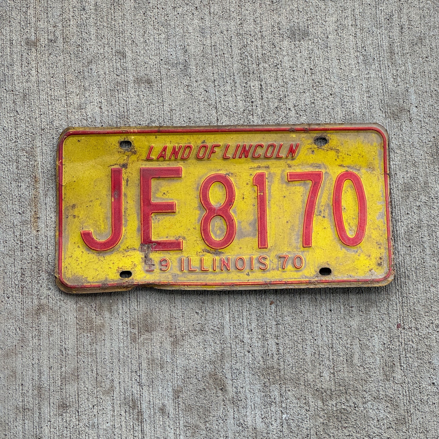 Photo of a 1970 Illinois License Plate Auto Tag 2 Vintage Garage JE 8170 with original patina