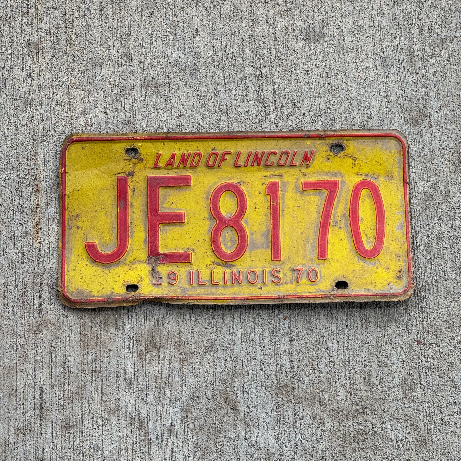 Photo of a 1970 Illinois License Plate Auto Tag 2 Vintage Garage JE 8170 with original patina
