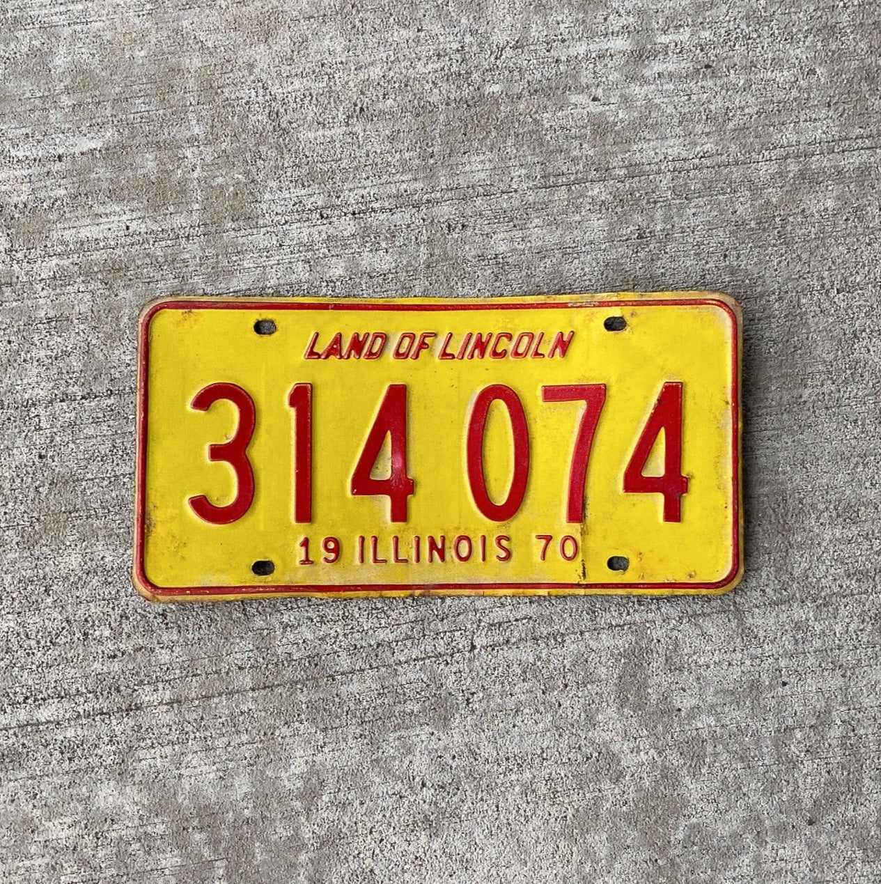 Photo of a 1970 Illinois License Plate Auto Tag Garage Decor Vintage 314074 with original patina