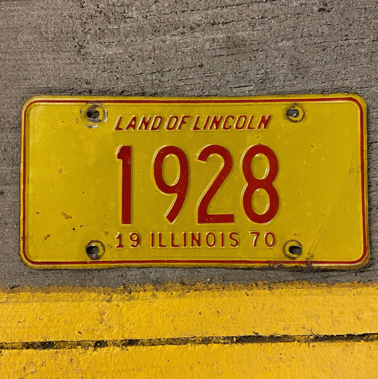 Photo of a 1970 Illinois License Plate Auto Tag Garage Decor Vintage Low Number Four Digit 1928 with original patina