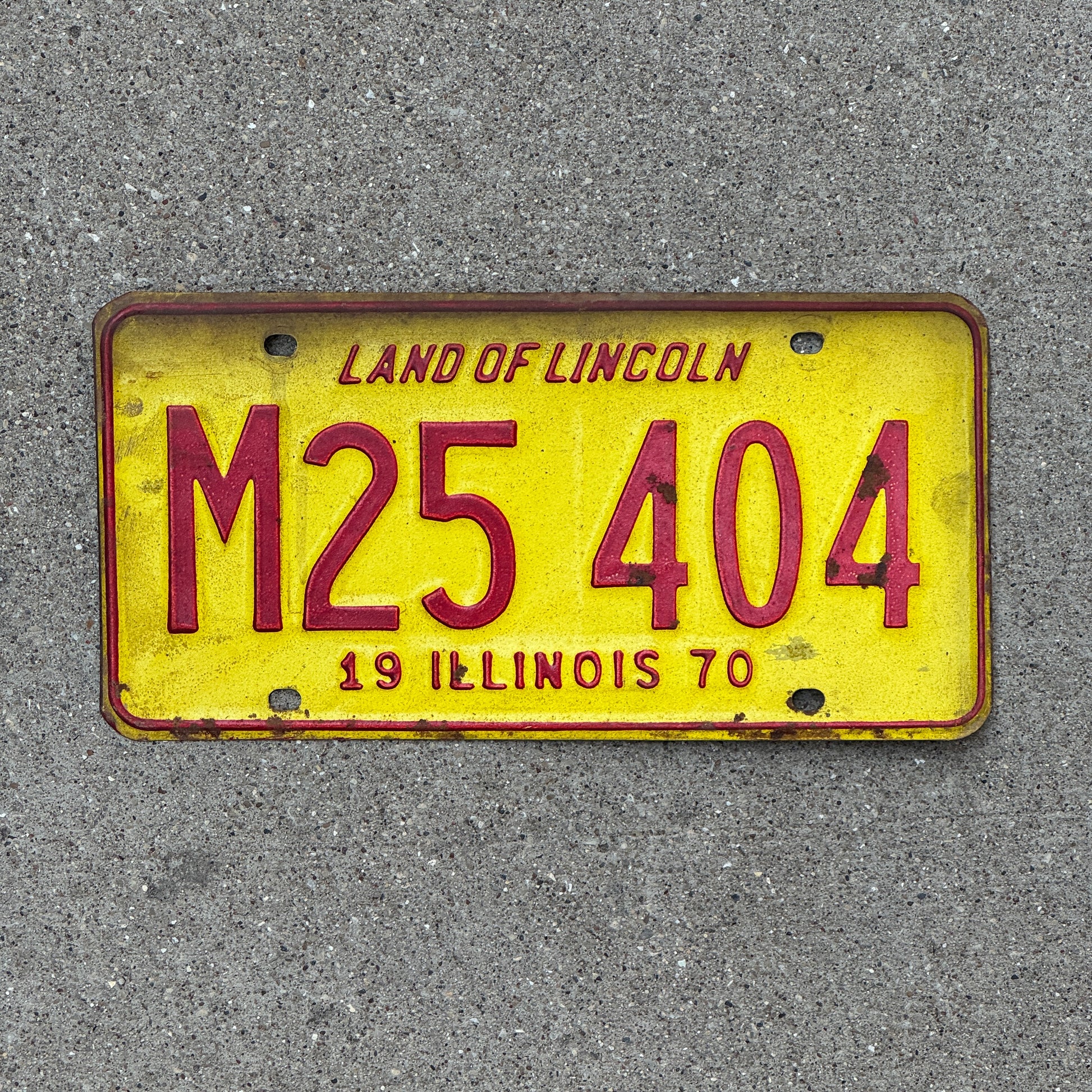 Photo of a 1970 Illinois Municipal License Plate Auto Tag 1 Vintage Garage M 25 404 with original patina