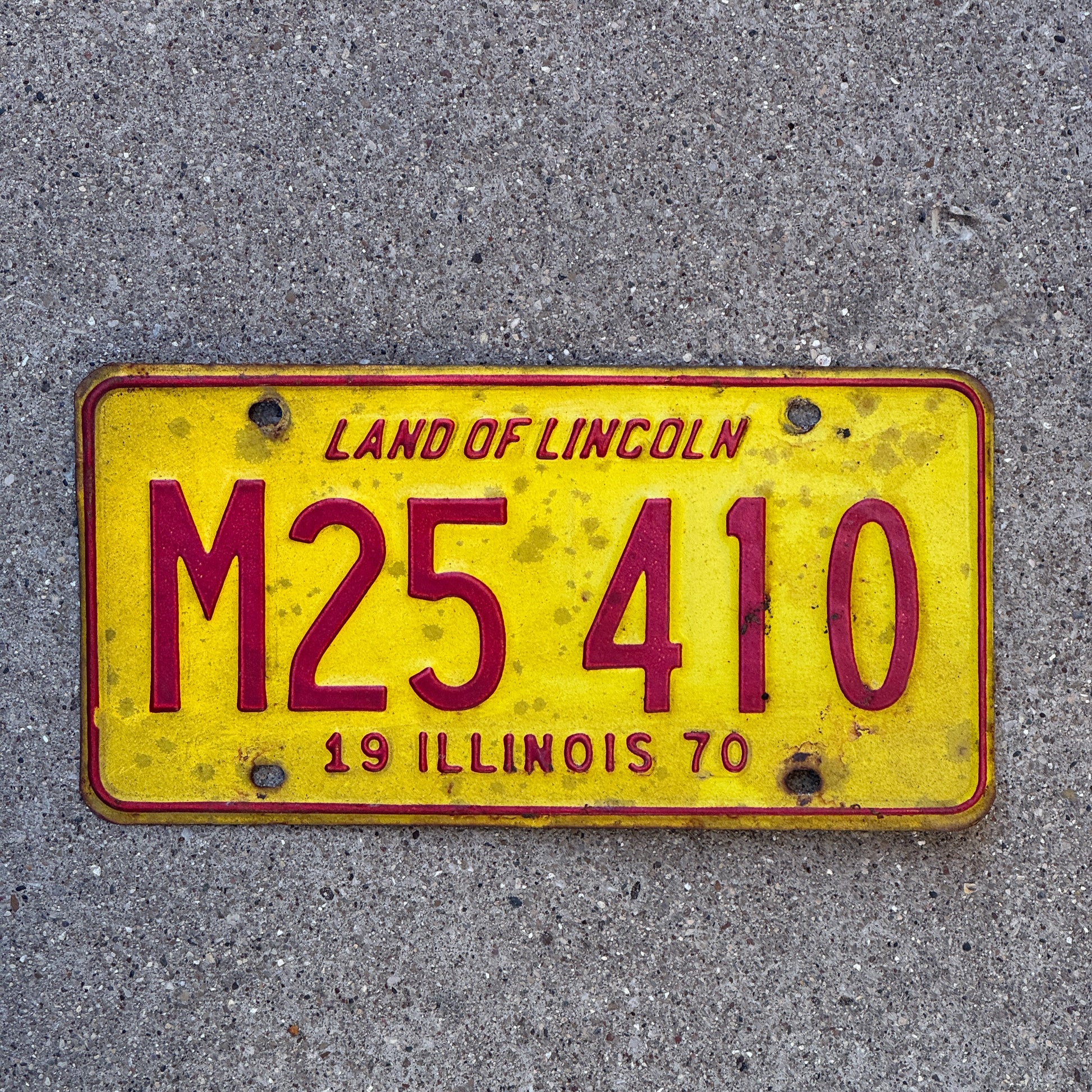 Photo of a 1970 Illinois Municipal License Plate Auto Tag 1 Vintage Garage M 25 410 with original patina