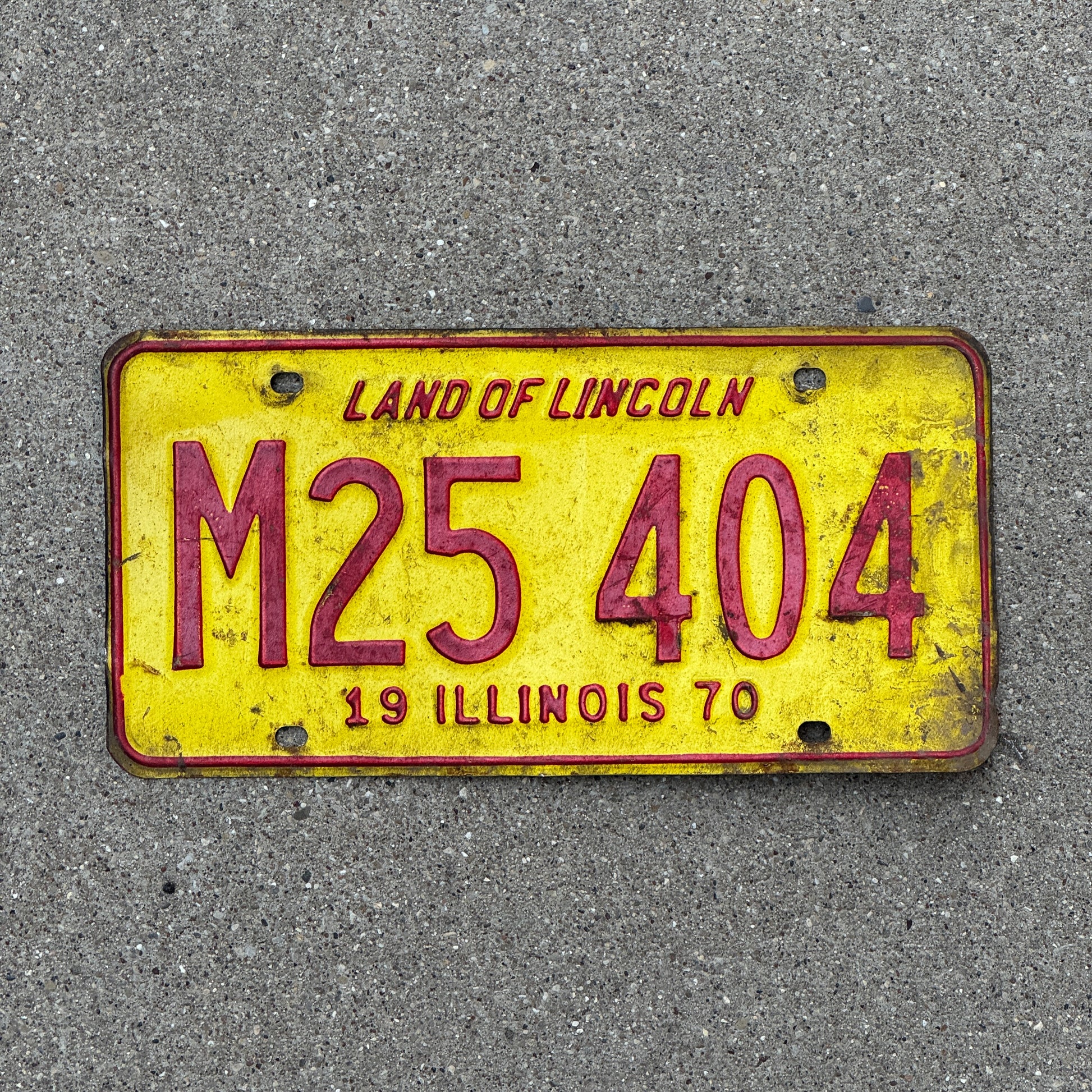 Photo of a 1970 Illinois Municipal License Plate Auto Tag 2 Vintage Garage M 25 404 with original patina