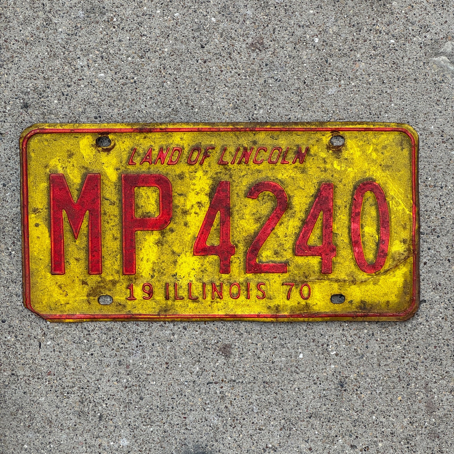 Photo of a 1970 Illinois Truck Mileage Tax License Plate Auto Tag 2 Vintage Garage MP 4240 with original patina