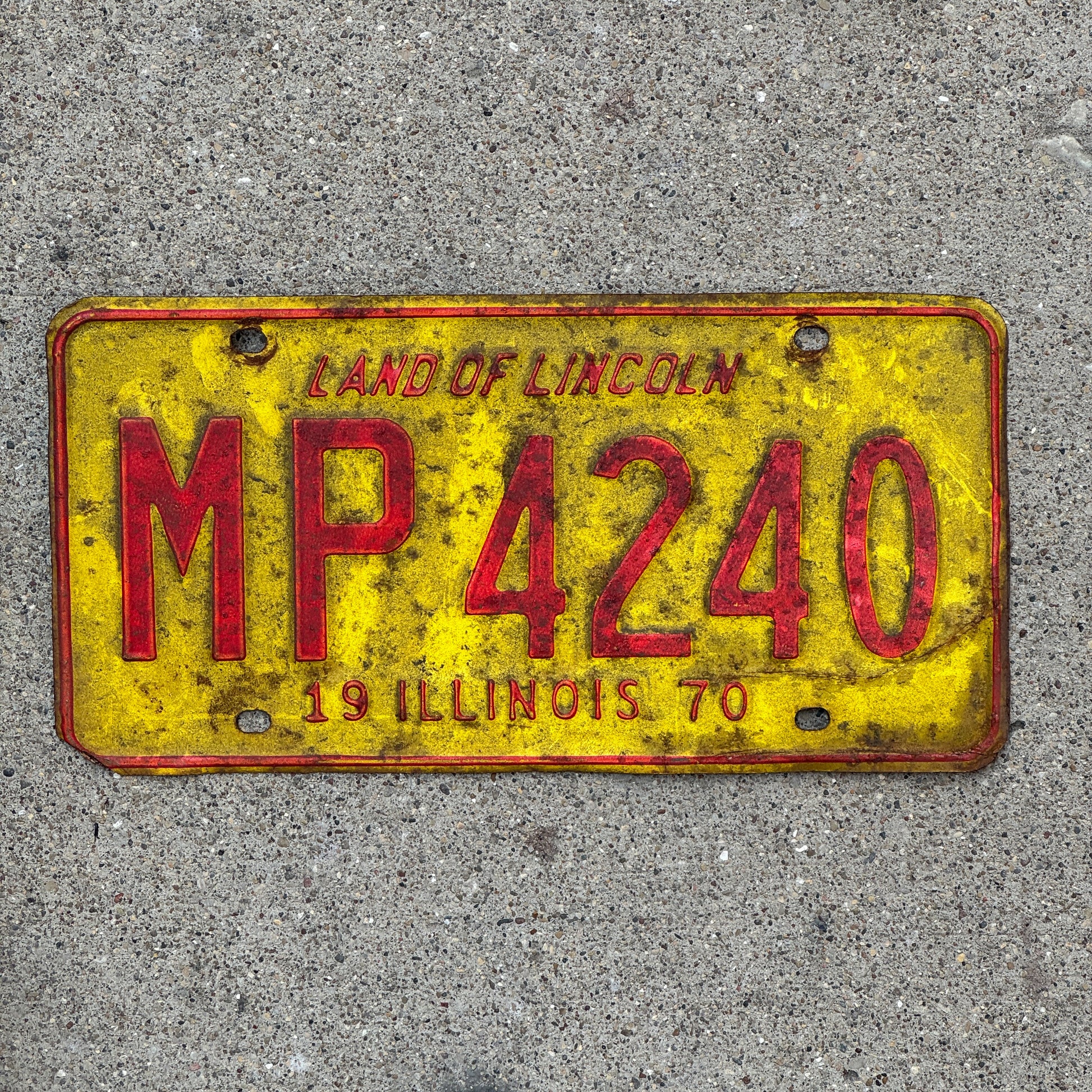 Photo of a 1970 Illinois Truck Mileage Tax License Plate Auto Tag 2 Vintage Garage MP 4240 with original patina