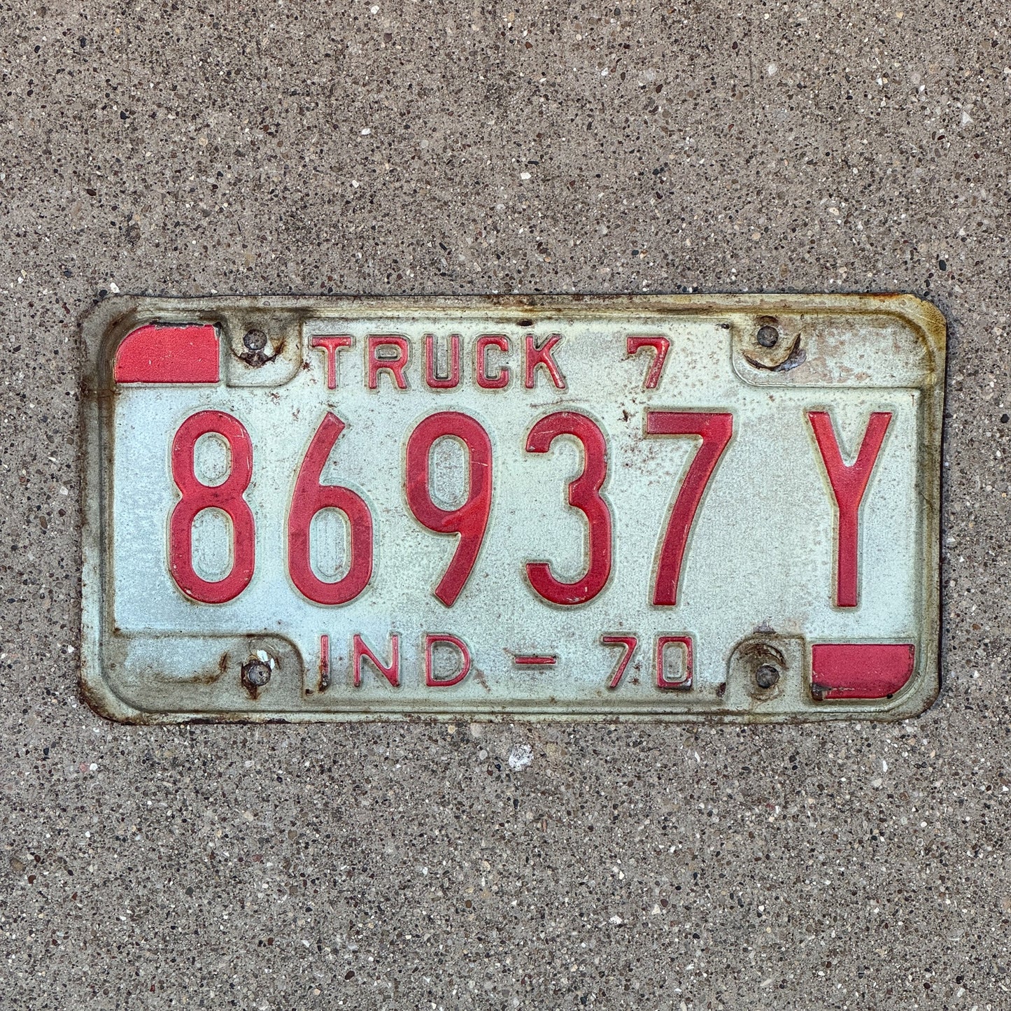 Photo of a 1970 Indiana Truck License Plate Auto Tag Garage Decor Vintage 86937 Y with original patina