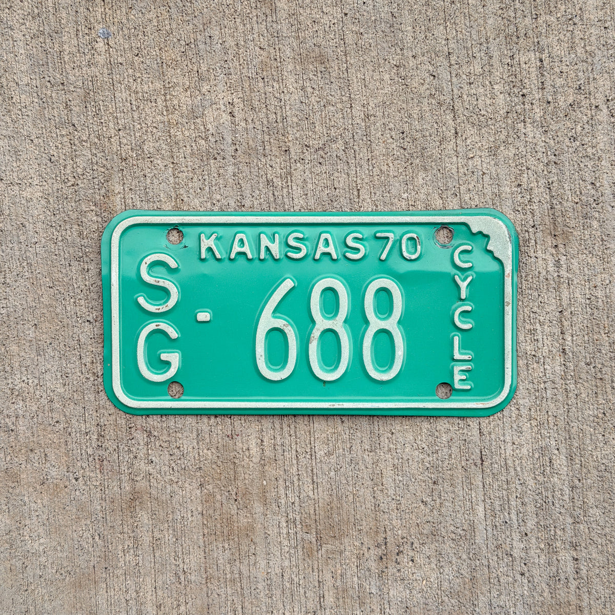 Photo of a 1970 Kansas Motorcycle License Plate Auto Tag Garage Decor Vintage SG 688 with original patina