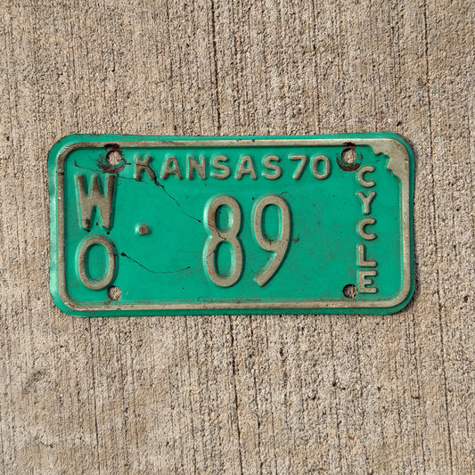 Photo of a 1970 Kansas Motorcycle License Plate Auto Tag Garage Decor Vintage WO 89 with original patina