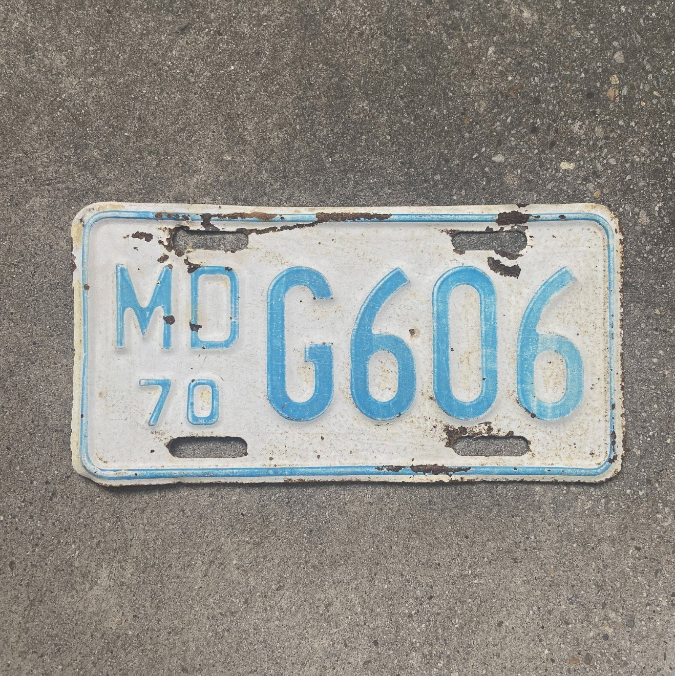 Photo of a 1970 Maryland Motorcycle License Plate Auto Tag Garage Decor Vintage G 606 with original patina