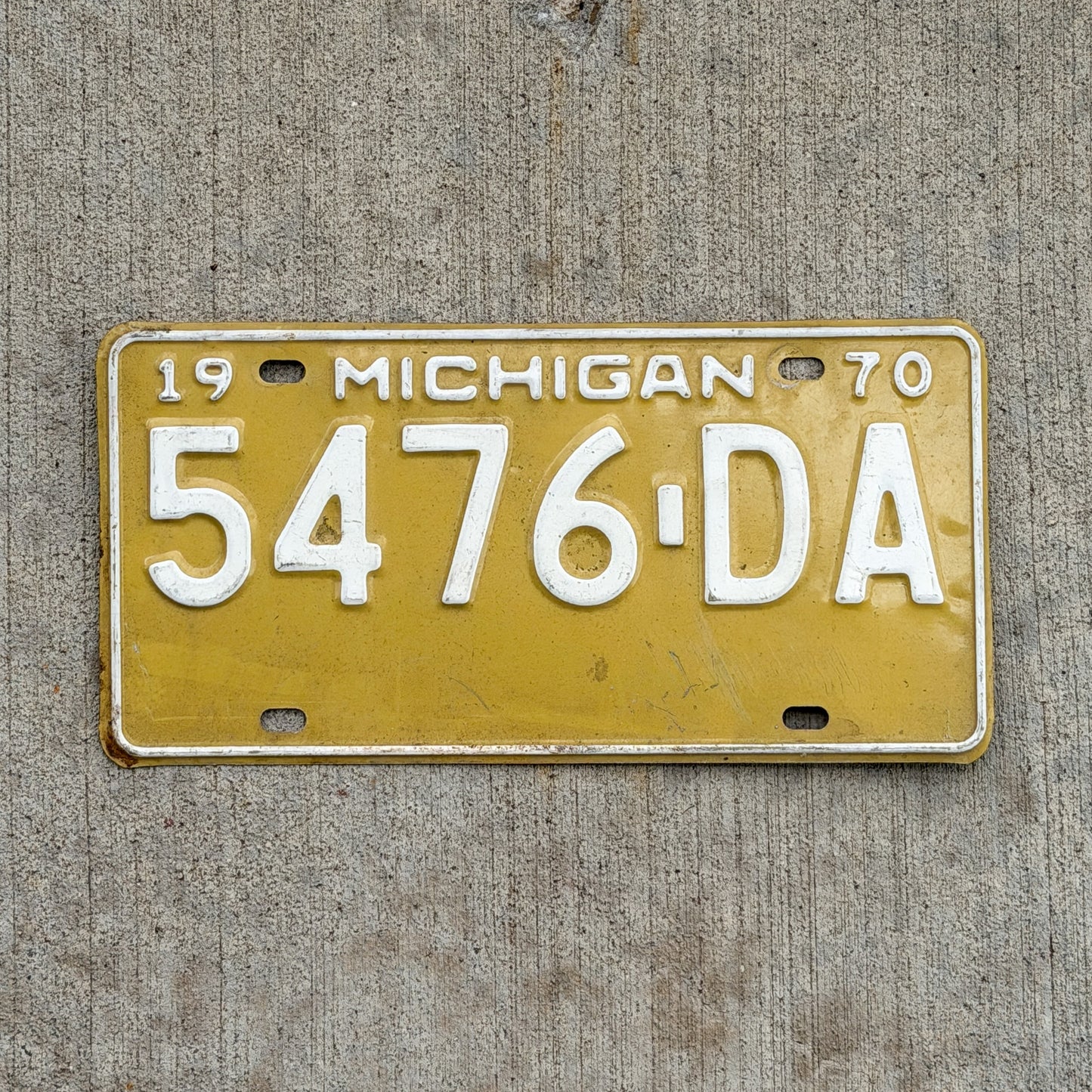 Photo of a 1970 Michigan Commercial License Plate Auto Tag Garage Decor Vintage 5476 DA with original patina