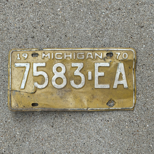 Photo of a 1970 Michigan Commercial License Plate Auto Tag Garage Decor Vintage 7583 EA with original patina