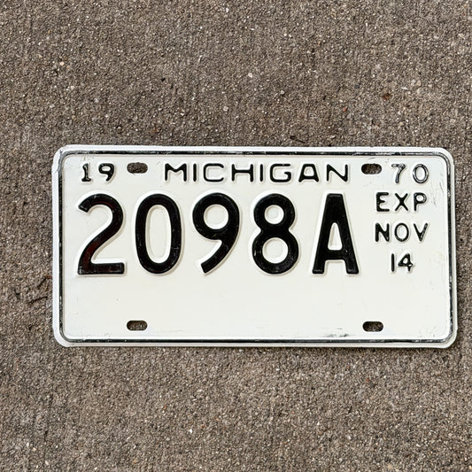 Photo of a 1970 Michigan Commercial License Plate Auto Tag Garage Decor Vintage Half Year 2098 A with original patina