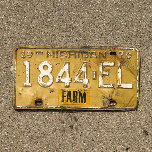 Photo of a 1970 Michigan Farm License Plate Auto Tag Garage Decor Vintage 1844 EL with original patina