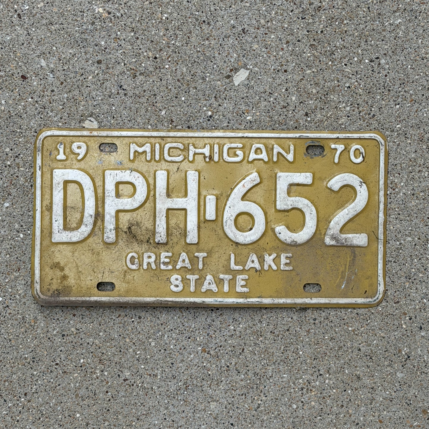 Photo of a 1970 Michigan License Plate Auto Tag 1 Vintage Garage DPH 652 with original patina