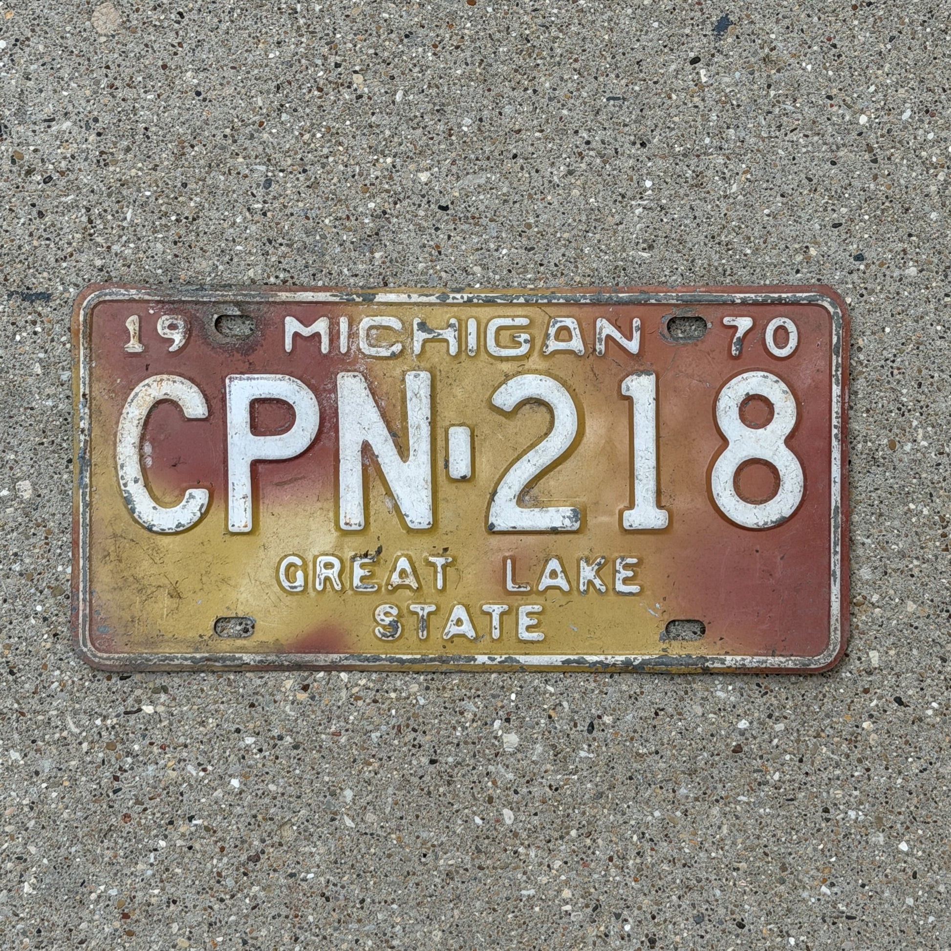 Photo of a 1970 Michigan License Plate Auto Tag 2 Vintage Garage CPN 218 with original patina