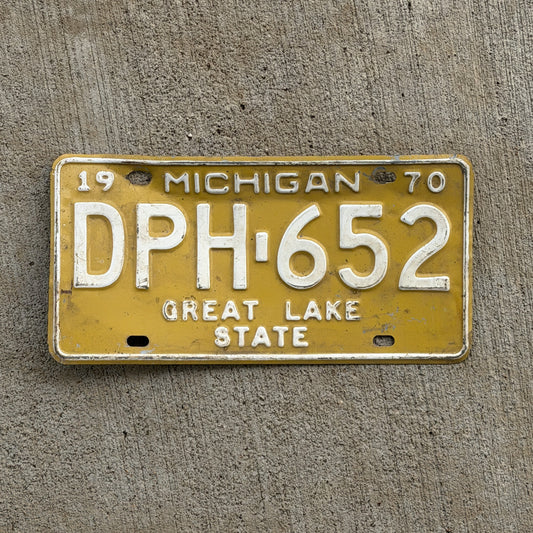 Photo of a 1970 Michigan License Plate Auto Tag 2 Vintage Garage DPH 652 with original patina