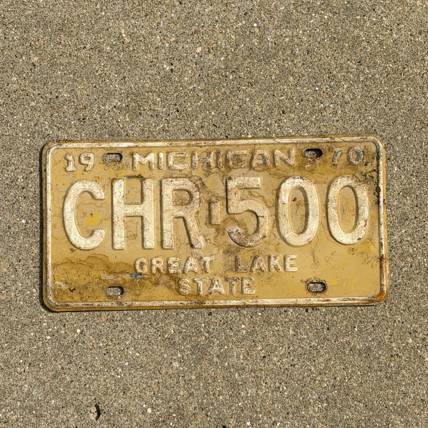 Photo of a 1970 Michigan License Plate Auto Tag Garage Decor Vintage CHR 500 with original patina