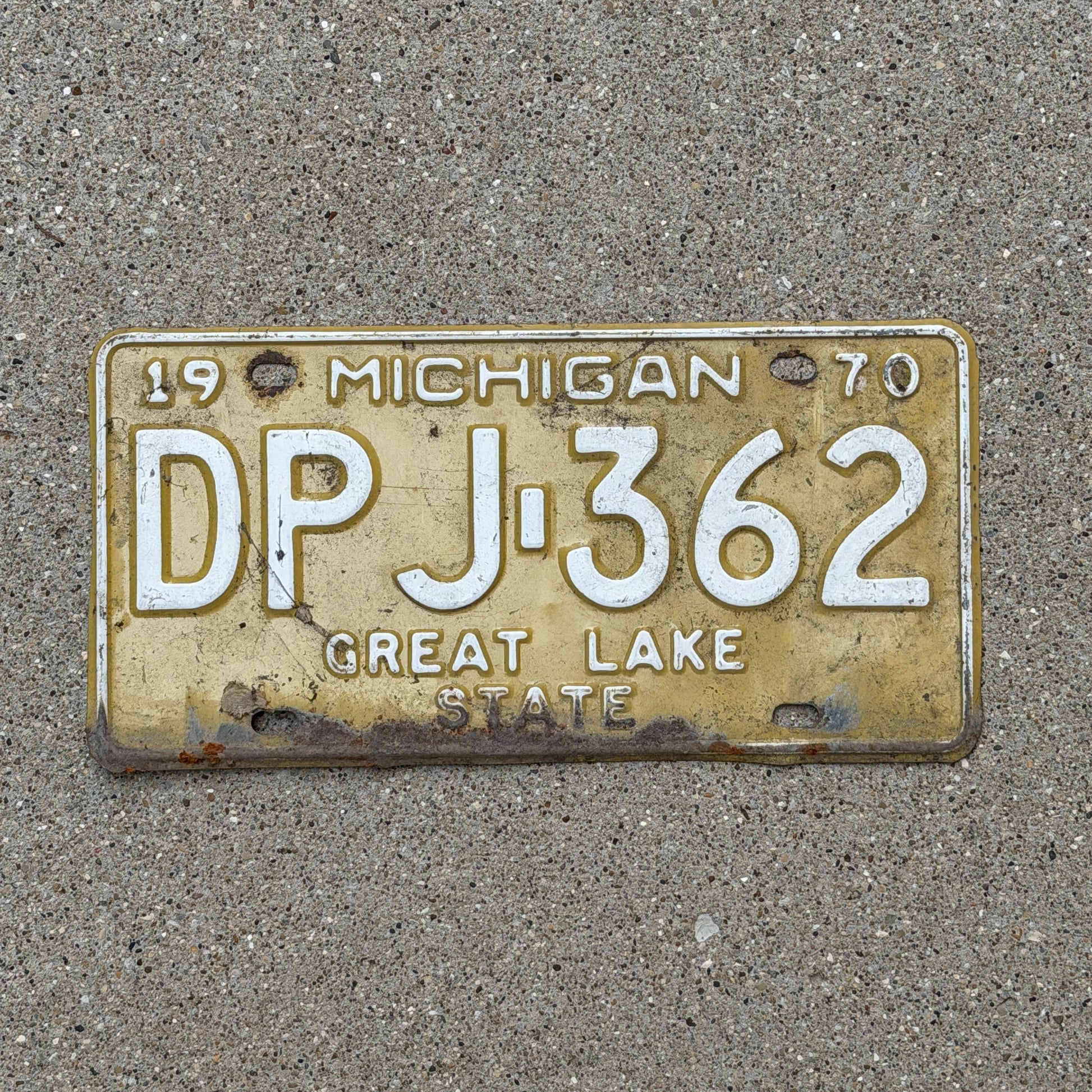 Photo of a 1970 Michigan License Plate Auto Tag Garage Decor Vintage DPJ 362 with original patina