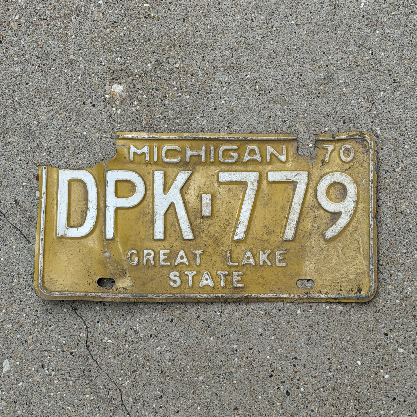 Photo of a 1970 Michigan License Plate Auto Tag Garage Decor Vintage DPK 779 with original patina