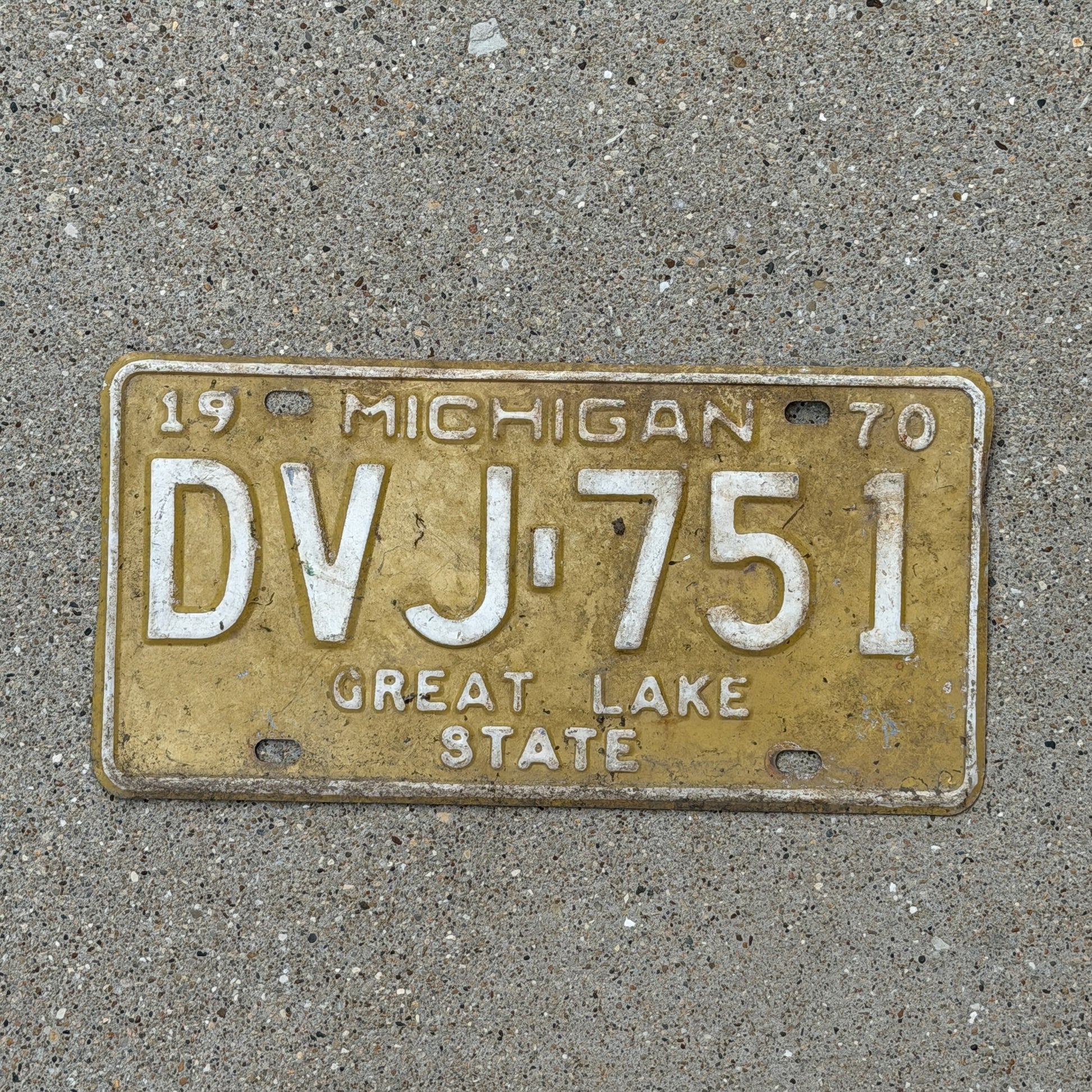 Photo of a 1970 Michigan License Plate Auto Tag Garage Decor Vintage DVJ 751 with original patina