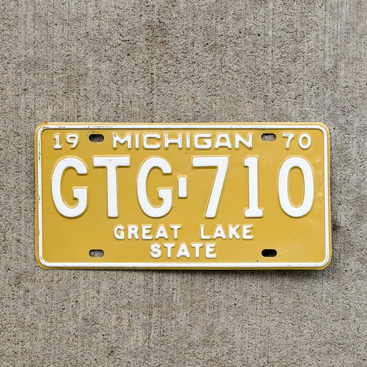 Photo of a 1970 Michigan License Plate Auto Tag Garage Decor Vintage GTG 710 with original patina