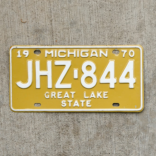 Photo of a 1970 Michigan License Plate Auto Tag Garage Decor Vintage JHZ 844 with original patina