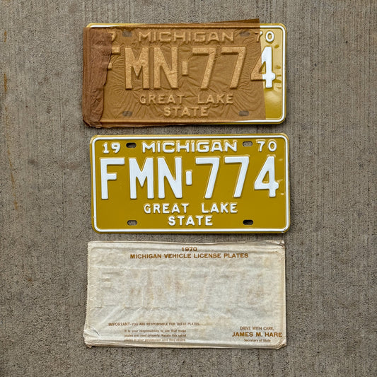 Photo of a 1970 Michigan License Plate Pair Auto Tag Garage Decor Vintage NOS with Original Mailing Envelope FMN 774