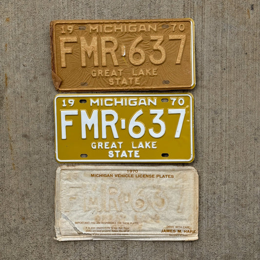 Photo of a 1970 Michigan License Plate Pair Auto Tag Garage Decor Vintage NOS with Original Mailing Envelope FMR 637