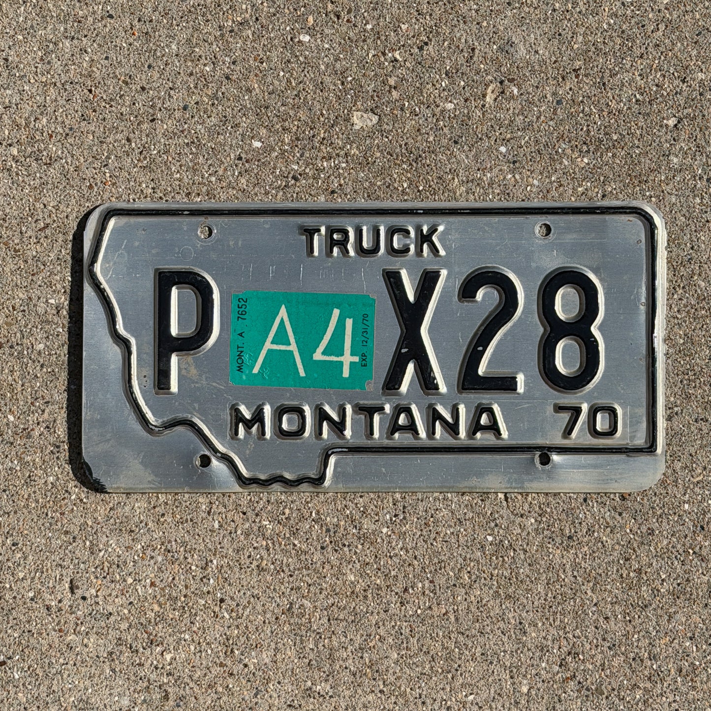 Photo of a 1970 Montana Prorate Power License Plate Auto Tag Garage Decor Vintage State Shape P X28 with original patina