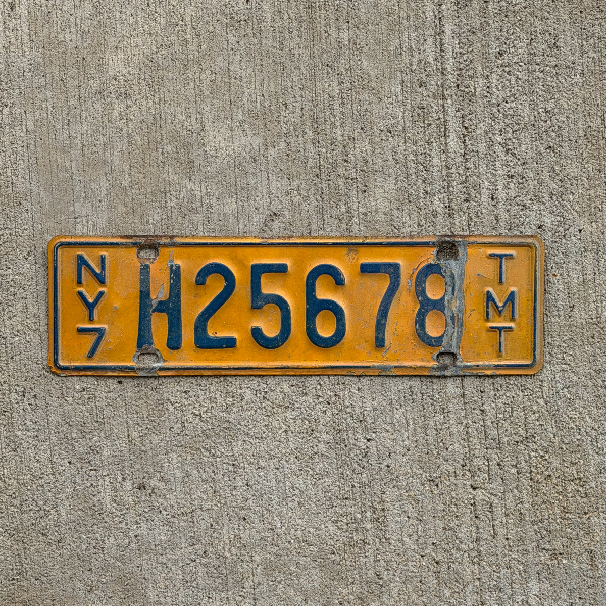 Photo of a 1970 New York Truck Mile Tax License Plate Auto Tag Garage Decor Vintage Series 8 H 25678 with original patina