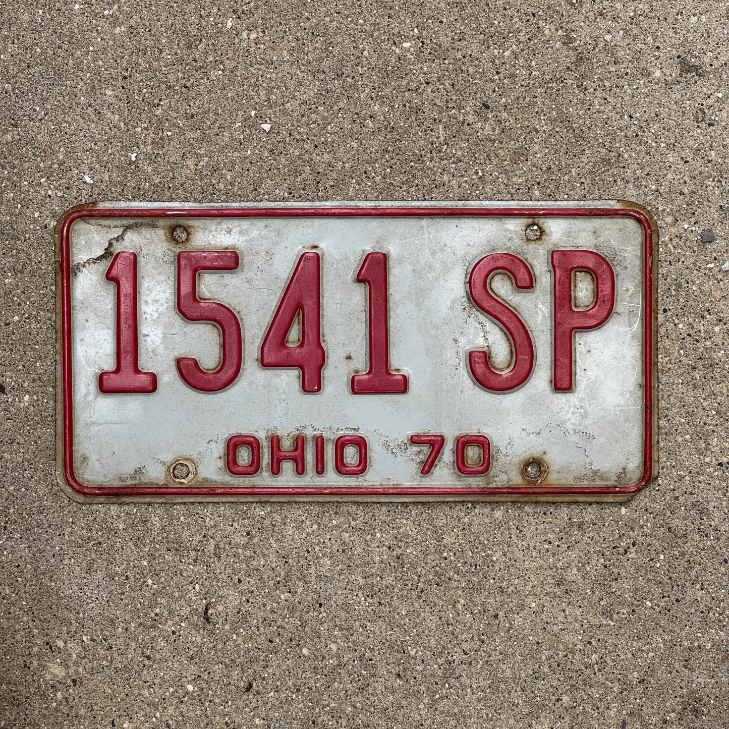 Photo of a 1970 Ohio License Plate Auto Tag 1 Vintage Garage 1541 SP with original patina