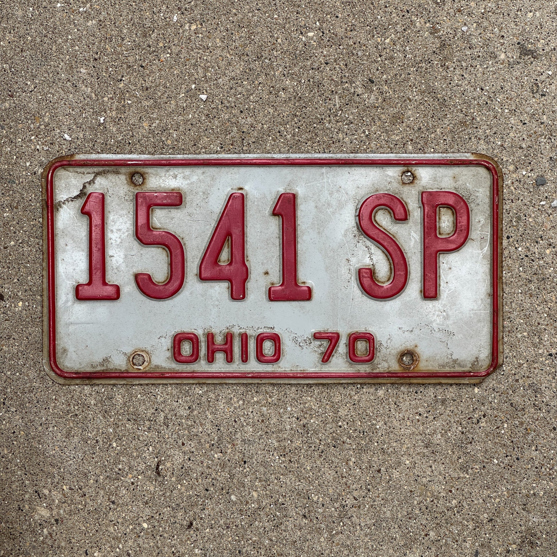 Photo of a 1970 Ohio License Plate Auto Tag 1 Vintage Garage 1541 SP with original patina