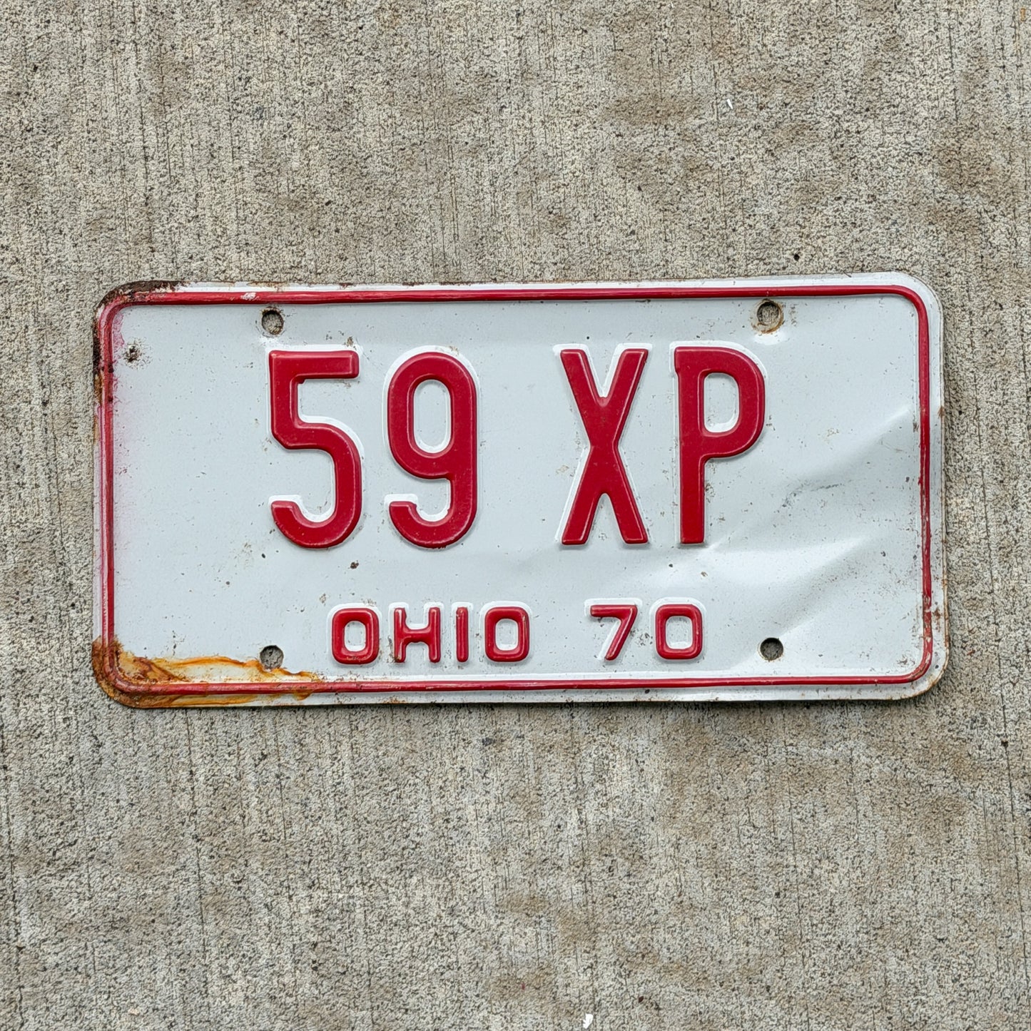 Photo of a 1970 Ohio License Plate Auto Tag Garage Decor Vintage 59 XP with original patina