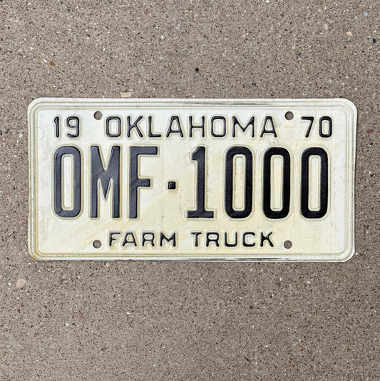Photo of a 1970 Oklahoma Farm Truck License Plate Auto Tag Garage Decor Vintage Nice Number 0 MF 1000 with original patina