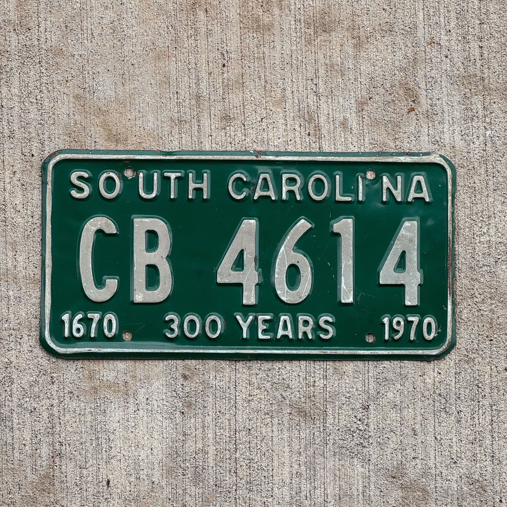 Photo of a 1970 South Carolina License Plate Auto Tag Garage Decor Vintage Tercenteary CB 4614 with original patina