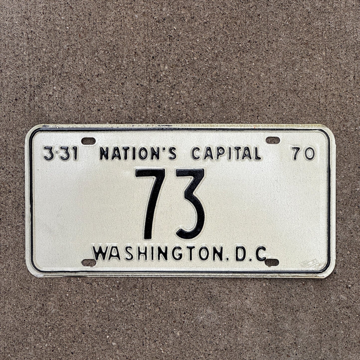 Photo of a 1970 Washington DC License Plate Auto Tag Garage Decor Vintage Low Number Two Digit 73 with original patina