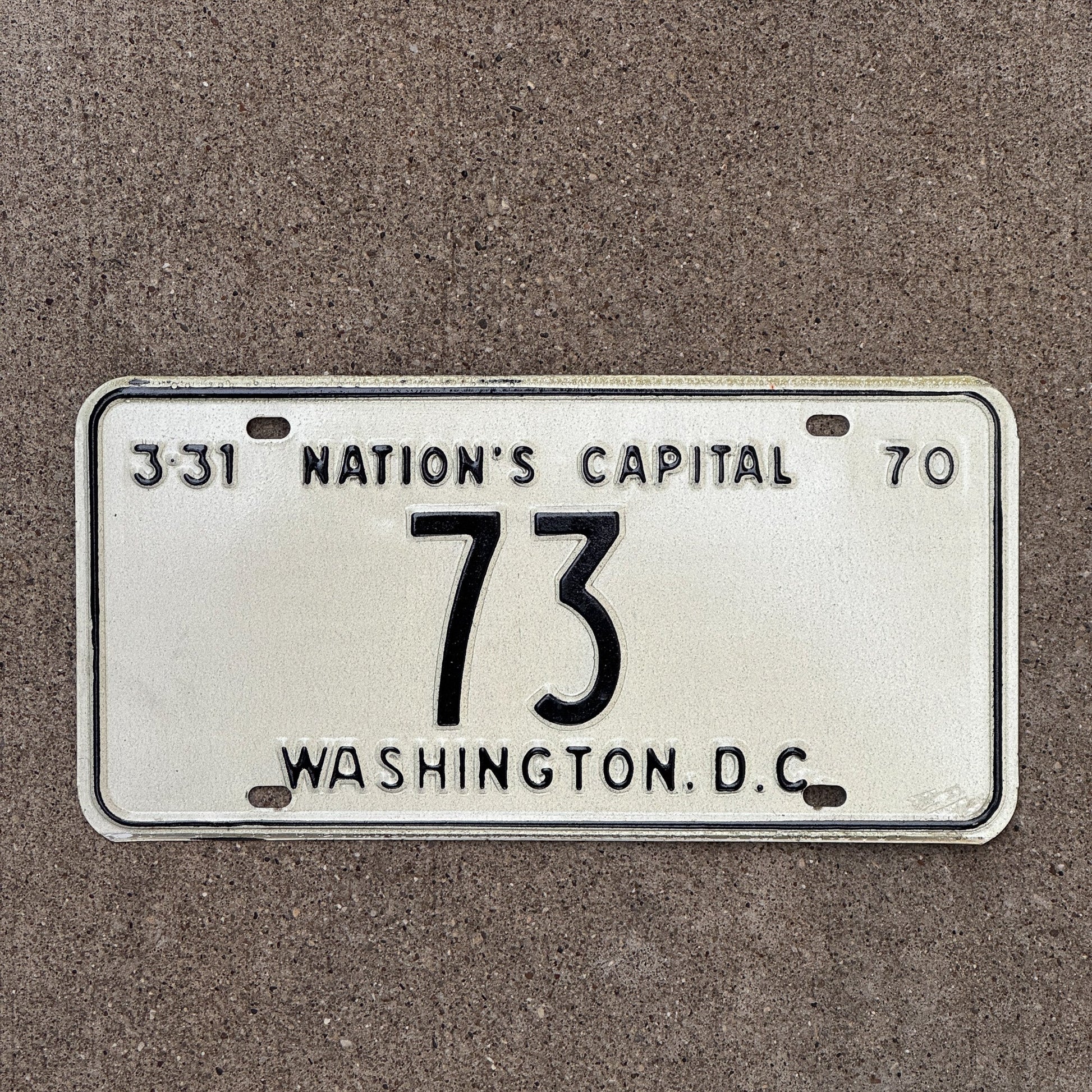 Photo of a 1970 Washington DC License Plate Auto Tag Garage Decor Vintage Low Number Two Digit 73 with original patina