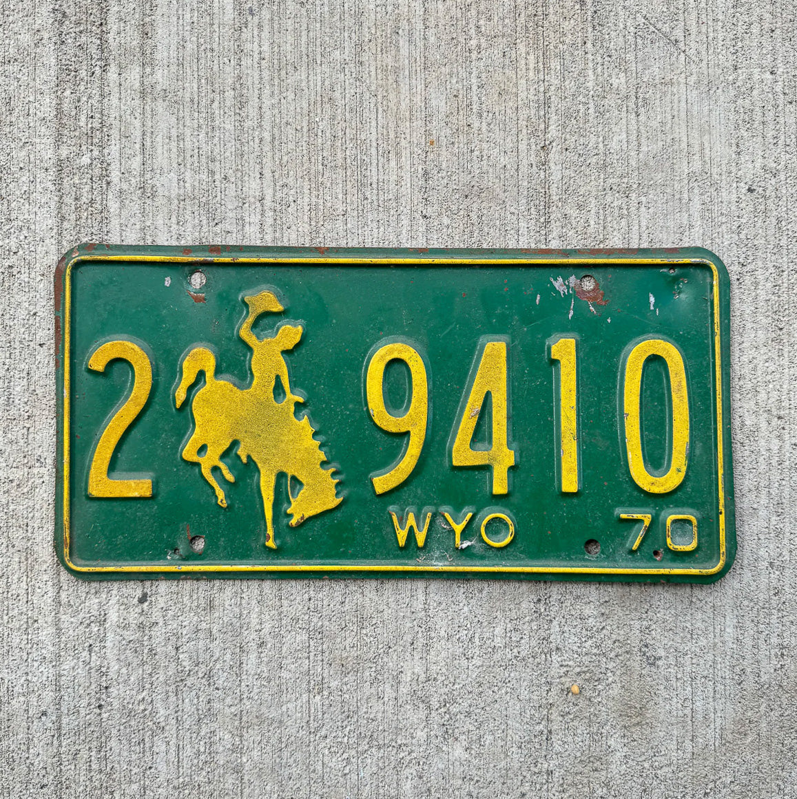 Photo of a 1970 Wyoming License Plate Auto Tag 2 Vintage Garage Cowboy Rodeo 2 9410 with original patina
