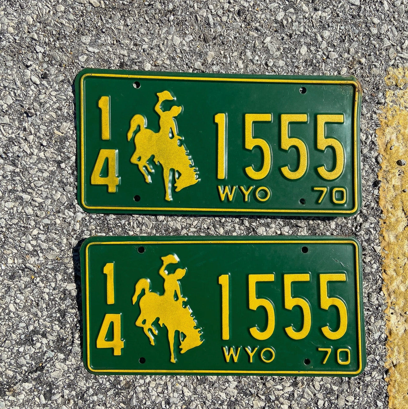 Photo of a 1970 Wyoming License Plate Pair Auto Tag Garage Decor Vintage Cowboy Rodeo Repeat Repeating 14 1555 with original patina