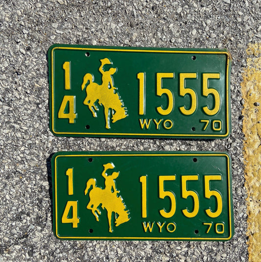 Photo of a 1970 Wyoming License Plate Pair Auto Tag Garage Decor Vintage Cowboy Rodeo Repeat Repeating 14 1555 with original patina