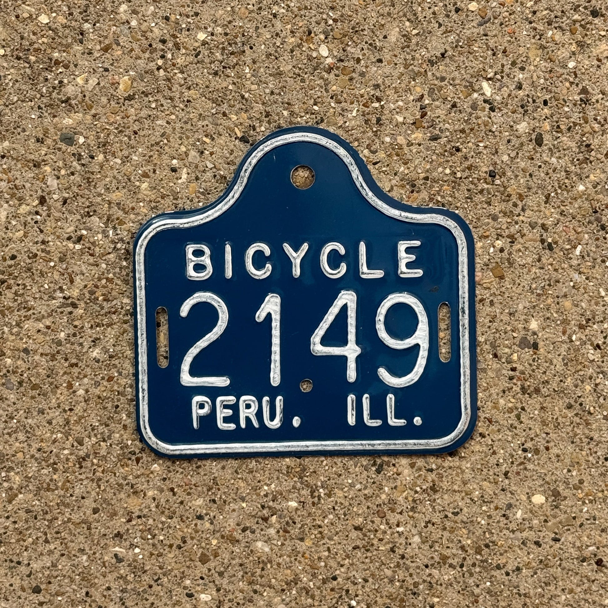 Photo of a 1970s Era Illinois Bicycle Auto Tag Garage Decor Vintage Peru 2149