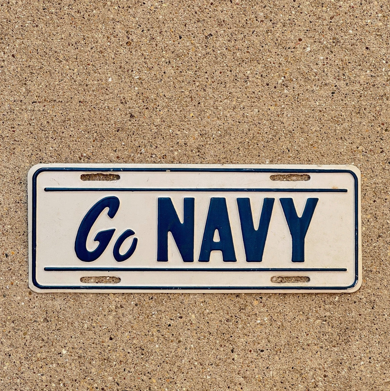 Photo of a 1970s Era License Plate Topper Auto Tag Garage Decor Vintage Booster Embossed Military Metal USA Vet GO NAVY